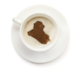 Cup of coffee with foam and powder in the shape of Iraq.(series)