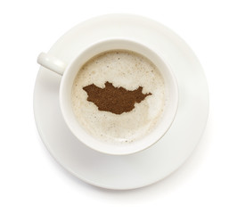 Cup of coffee with foam and powder in the shape of Mongolia.(ser