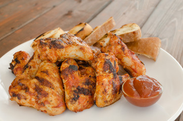 Chicken wings on grill