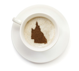 Cup of coffee with foam and powder in the shape of Queensland.(s