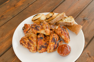 Chicken wings on grill