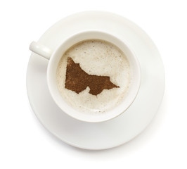 Cup of coffee with foam and powder in the shape of Victoria.(ser