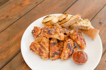 Chicken wings on grill