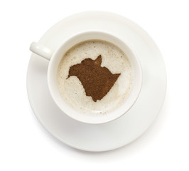 Cup of coffee with foam and powder in the shape of New Brunswick
