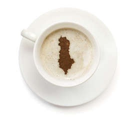 Cup of coffee with foam and powder in the shape of Albania.(seri