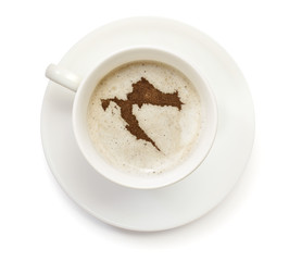 Cup of coffee with foam and powder in the shape of Croatia.(seri