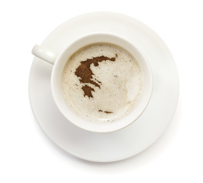 Cup Of Coffee With Foam And Powder In The Shape Of Greece.(serie