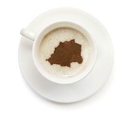 Cup of coffee with foam and powder in the shape of Vatican City.