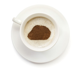 Cup of coffee with foam and powder in the shape of Baker Island.