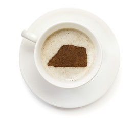 Cup of coffee with foam and powder in the shape of Jarvis Island