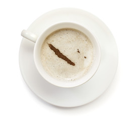 Cup of coffee with foam and powder in the shape of New Caledonia