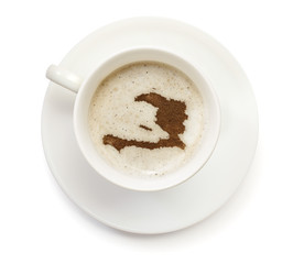 Cup of coffee with foam and powder in the shape of Haiti.(series