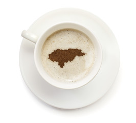 Cup of coffee with foam and powder in the shape of Honduras.(ser