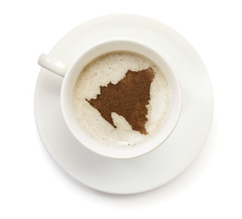 Cup of coffee with foam and powder in the shape of Nicaragua.(se