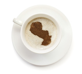 Cup of coffee with foam and powder in the shape of Paraguay.(ser