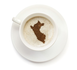 Cup of coffee with foam and powder in the shape of Peru.(series)