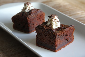 Chocolate Cake topped with whipped cream