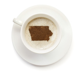 Cup of coffee with foam and powder in the shape of Iowa.(series)