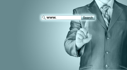 Businessman pushing virtual search bar