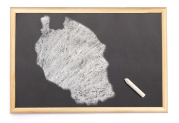 Blackboard with a chalk and the shape of Tanzania drawn onto. (s