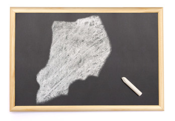 Blackboard with a chalk and the shape of Uganda drawn onto. (ser