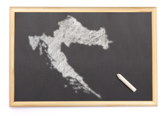 Blackboard with a chalk and the shape of Croatia drawn onto. (se