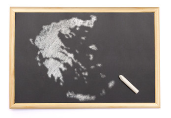 Blackboard with a chalk and the shape of Greece drawn onto. (ser