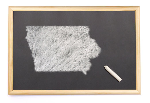 Blackboard with a chalk and the shape of Iowa drawn onto. (serie