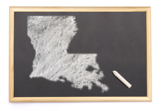 Blackboard with a chalk and the shape of Louisiana drawn onto. (