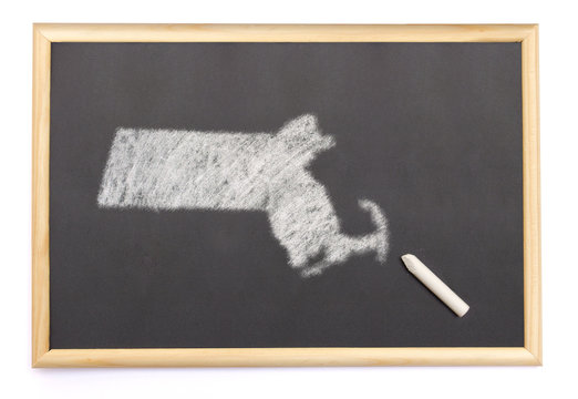 Blackboard with a chalk and the shape of Massachusetts drawn ont