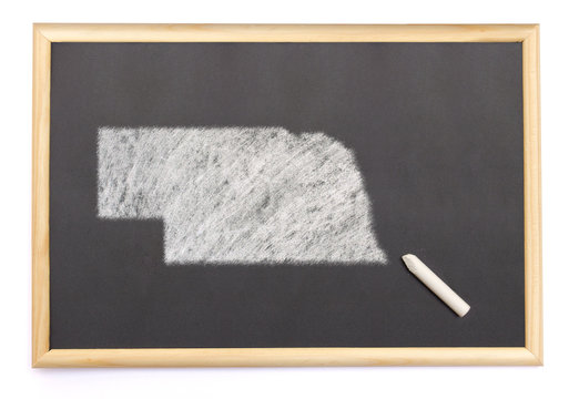 Blackboard with a chalk and the shape of Nebraska drawn onto. (s