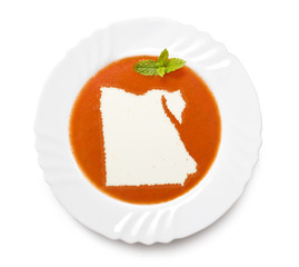 Plate tomato soup with cream in the shape of Egypt.(series)