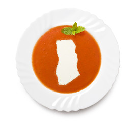 Plate tomato soup with cream in the shape of Ghana.(series)