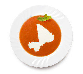 Plate tomato soup with cream in the shape of Mali.(series)
