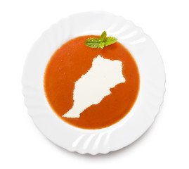Plate tomato soup with cream in the shape of Morocco.(series)