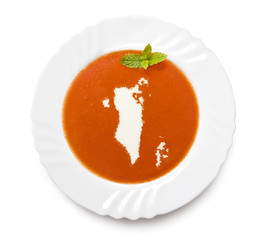 Plate tomato soup with cream in the shape of Bahrain.(series)