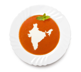 Plate tomato soup with cream in the shape of India.(series)