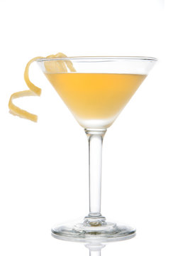 Yellow Banana Cocktail In Martini Glass With Lemon Twist