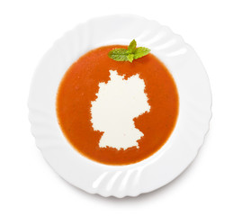 Plate tomato soup with cream in the shape of Germany.(series)