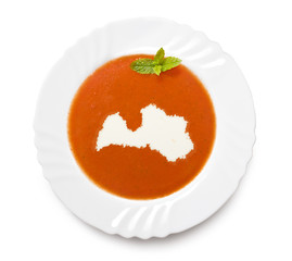 Plate tomato soup with cream in the shape of Latvia.(series)