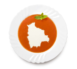 Plate tomato soup with cream in the shape of Bolivia.(series)