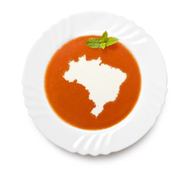 Plate tomato soup with cream in the shape of Brazil.(series)