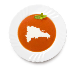 Plate tomato soup with cream in the shape of Dominican Republic.