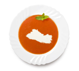 Plate tomato soup with cream in the shape of El Salvador.(series