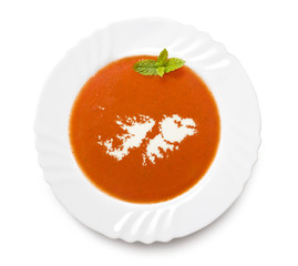 Plate tomato soup with cream in the shape of Falkland Islands.(s