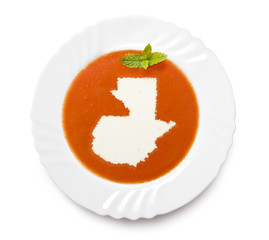 Plate tomato soup with cream in the shape of Guatemala.(series)