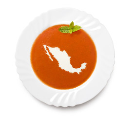 Plate tomato soup with cream in the shape of Mexico.(series)