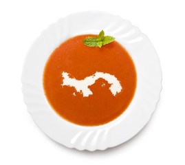 Plate tomato soup with cream in the shape of Panama.(series)