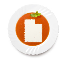 Plate tomato soup with cream in the shape of Utah.(series)