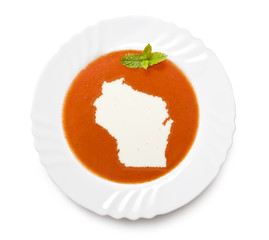 Plate tomato soup with cream in the shape of Wisconsin.(series)
